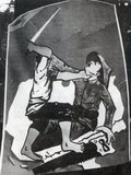 The poster shows a Khmer patriot attacking a Vietnamese who has been attempting to saw off Cambodian national territory in the south and east.