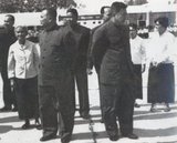 The Khmer Rouge Leadership at Pochentong Airport c. 1976. Left to right: Unknown, Khieu Ponnary, Nuon Chea, Vorn Vet, Ieng Sary (partly obscured), Pol Pot, Yun Yat (partly obscured), Ieng Thirith.<br/><br/>

The Khmer Rouge, or Communist Party of Kampuchea, ruled  Cambodia from 1975 to 1979, led by Pol Pot, Nuon Chea, Ieng Sary, Son Sen and Khieu Samphan. It is remembered primarily for its brutality and policy of social engineering which resulted in millions of deaths. Its attempts at agricultural reform led to widespread famine, while its insistence on absolute self-sufficiency, even in the supply of medicine, led to the deaths of thousands from treatable diseases (such as malaria). Brutal and arbitrary executions and torture carried out by its cadres against perceived subversive elements, or during purges of its own ranks between 1976 and 1978, are considered to have constituted a genocide. Several former Khmer Rouge cadres are currently on trial for war crimes in Phnom Penh.

