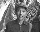 Kang Kek Iew or Kaing Kek Iev, Kaing Guek Eav (Comrade Duch or Deuch), a Sino-Khmer with the Chinese name Hang Pin, was born 17 November 1942 in Choyaot village, Kampong Chen subdistrict, Kampong Thom Province. He is best known for heading the Khmer Rouge special branch (Santebal) and running the infamous Tuol Sleng (S-21) prison camp in Phnom Penh. The first Khmer Rouge leader to be tried by the Extraordinary Chambers in the Courts of Cambodia for the crimes of the regime, he was convicted of crimes against humanity, murder, and torture for his role in the Cambodian Holocaust and sentenced to 35 years' imprisonment.<br/><br/>

The Khmer Rouge, or Communist Party of Kampuchea, ruled  Cambodia from 1975 to 1979, led by Pol Pot, Nuon Chea, Ieng Sary, Son Sen and Khieu Samphan. It is remembered primarily for its brutality and policy of social engineering which resulted in millions of deaths. Its attempts at agricultural reform led to widespread famine, while its insistence on absolute self-sufficiency, even in the supply of medicine, led to the deaths of thousands from treatable diseases (such as malaria). Brutal and arbitrary executions and torture carried out by its cadres against perceived subversive elements, or during purges of its own ranks between 1976 and 1978, are considered to have constituted a genocide. Several former Khmer Rouge cadres are currently on trial for war crimes in Phnom Penh.