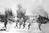 Rare image taken by a Vietnamese military photographer of Vietnamese soldiers advancing under fire into the heart of Phnom Penh. The depopulated city, inhabited only by Khmer Rouge leadership and forces, fell to the Vietnamese on January 7, 1979.<br/><br/>

The Khmer Rouge, or Communist Party of Kampuchea, ruled  Cambodia from 1975 to 1979, led by Pol Pot, Nuon Chea, Ieng Sary, Son Sen and Khieu Samphan. It is remembered primarily for its brutality and policy of social engineering which resulted in millions of deaths. Its attempts at agricultural reform led to widespread famine, while its insistence on absolute self-sufficiency, even in the supply of medicine, led to the deaths of thousands from treatable diseases (such as malaria). Brutal and arbitrary executions and torture carried out by its cadres against perceived subversive elements, or during purges of its own ranks between 1976 and 1978, are considered to have constituted a genocide. Several former Khmer Rouge cadres are currently on trial for war crimes in Phnom Penh.