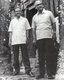 Cambodia: Son Sen (June 12, 1930 – June 10, 1997), Defense Minister of Democratic Kampuchea, with unidentified foreign visitor at Angkor, c.1976-77.